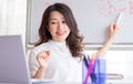 Asian female teacher teaching online at home Royalty Free Stock Photo