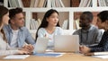 Asian female team leader explaining new school research project details. Royalty Free Stock Photo