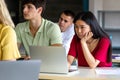 Asian female teen college student in class listening to lecture using laptop to take notes. Royalty Free Stock Photo