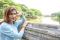 Asian female tourist with Mae Kuang River background