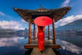 Asian female tourist stands on the water hall at Ban Rak Thai, Mae Hong Son Province, Thailand