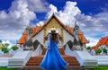 Asian female tourist wearing a blue dress visits Phumin Temple in Nan province, Thailand