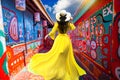 .Asian female tourists visit the old house at Rainbow Village, colorful paintings on the walls in Taichung. It is a famous tourist Royalty Free Stock Photo