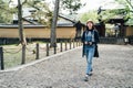 Asian female travel photographer walking