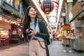 Asian female visiting japanese market.