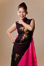 Asian female wearing a pink Vietnamese dress