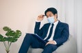 Asian Financial Advisor Wear Face Mask Planing Statement in Vintage Tone Royalty Free Stock Photo