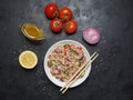 Asian Fish Salad on the black table. Top view. Royalty Free Stock Photo