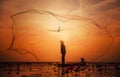 Asian Fisherman on boat fishing