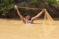 Asian fisherman with throw net Royalty Free Stock Photo