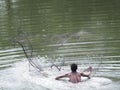 Asian fisherman with throw net. Royalty Free Stock Photo