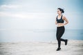 Asian fitness woman runner stretching legs before run Royalty Free Stock Photo