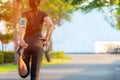 Asian fitness woman runner stretching legs before run outdoor workout in the park. Royalty Free Stock Photo