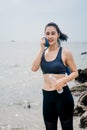 Asian fitness woman runner stretching legs before run Royalty Free Stock Photo