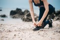 Asian fitness woman runner stretching legs before run Royalty Free Stock Photo