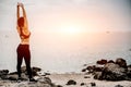 Asian fitness woman runner stretching legs before run Royalty Free Stock Photo