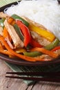 Asian food: chicken with vegetables and rice noodles vertical Royalty Free Stock Photo