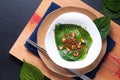 Asian food concept Homemade Korean organic Kkaennip Kimchi, PerillaShiso Kimchi in white ceramic bowl on wooden board with copy