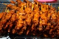 Asian food. A counter with mini kebabs of chicken skin and meat at a nightly street food market Royalty Free Stock Photo