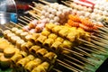 Asian food. Different mini barbecue counter at night street food market Royalty Free Stock Photo