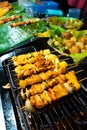 Asian food. Different mini barbecue counter at night street food market