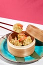Asian food - dim sum with shrimp in steamer. Dim sum with prawn in minimal style. Modern concept asian menu. Chinese dumplings on Royalty Free Stock Photo