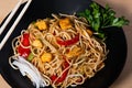 Asian food, fried yakisoba noodles with chicken. Isolated image