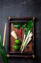 Asian food ingredients. Thai herbs and spices for thai cuisine on autentic thai tray, top view