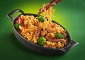 Asian food. Noodles with beef, broccoli, carrot in the metal pan. Doshirak with meat Royalty Free Stock Photo