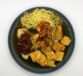 asian food, Noodles in a blue bowl with tofu on white Royalty Free Stock Photo