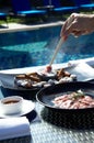 Asian food prepares on blue pool background