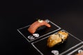 Hand drawn Poker cards with Japanese sushi nigiri on dark chalkboard background. Asian food with salmon tataki, eel, and black ric Royalty Free Stock Photo