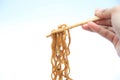 asian food, taking fried noodles with chopstick Royalty Free Stock Photo