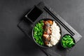 Asian food. Thai food. Rice with chicken and green onions on a dark background. Chinese food. Rice with spicy kung pao Royalty Free Stock Photo