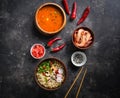 Asian food, Tom Yam and Ramen with shrimps, Thai food in wooden bowl, Egg noodles, Preparation, Chilli peppers, onion and mushroom Royalty Free Stock Photo