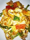 Closeup of Thai food: Stir-Fried Squid with Salted Duck Eggs Royalty Free Stock Photo