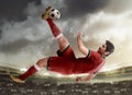 Asian football player kick ball Royalty Free Stock Photo