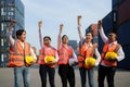 Asian foreman and his team staff in the container depot terminal arm raise celebration delighted to accomplish their goals success Royalty Free Stock Photo