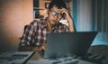 Asian freelance man having stressful depression sad time working on laptop home night. Depression man sad serios working from home