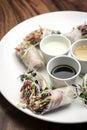 Asian fresh vegetable vegan spring rolls with sauces in vietnam