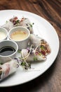 Asian fresh vegetable vegan spring rolls with sauces in vietnam