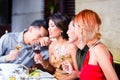 Asian friends dining in fancy restaurant Royalty Free Stock Photo