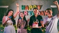 Asian friends having fun in outdoor birthday party at night club with birthday cake. Event and anniversary concept. People Royalty Free Stock Photo