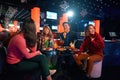 Asian friends having fun while singing karaoke on night party at the bar Royalty Free Stock Photo