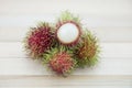 Asian fruit rambutan on wood background Royalty Free Stock Photo