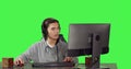 Asian gamer on desktop at workstation