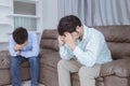 Asian gay couples are quarreling, angry or sad on sofa in home, LGBTQ concept.