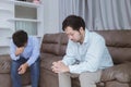 Asian gay couples are quarreling, angry or sad on sofa in home, LGBTQ concept.