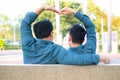 Asian gay couples Romantic Hand made heart-shaped hand to make love happily