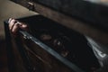 Asian ghost horror creepy scary hair covering face and eye lying in the old treasure chest